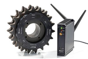 Image of the High Speed Telemetry Instrumented Sprocket product together with a 1-channel receiver