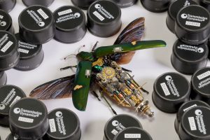 Smartbug® Wireless Vibration Sensors surrounding a representation of a flying insect