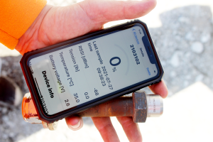Image of a mobile phone showing the display of the Boltsense App, along with a bolt