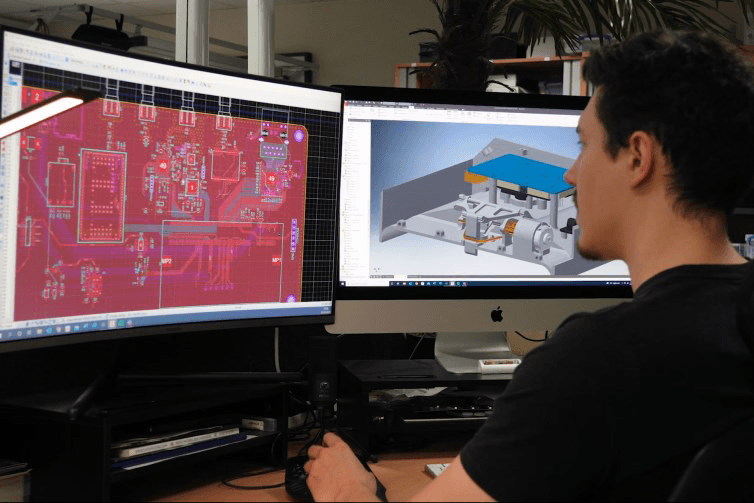Image of man working on dual monitor cad computer design