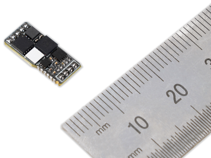 Image of Digital Load Cell Amplifier​ together with metric ruler for scale