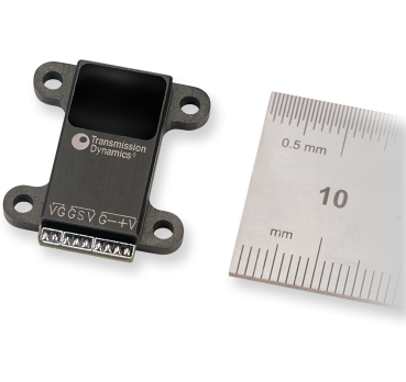 An image of a High Speed Telemetry unit alongside a metric ruler for scale