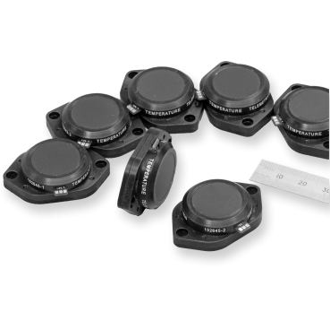 A bunch of High Speed Telemetry products together with a metric ruler to demonstrate scale.