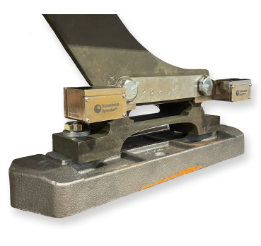 An image of the PANDAS 3R Precision Monitoring System attached to the foot of a train