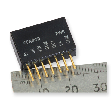 Image of Strain Gauge Amplifier together with metric ruler for scale