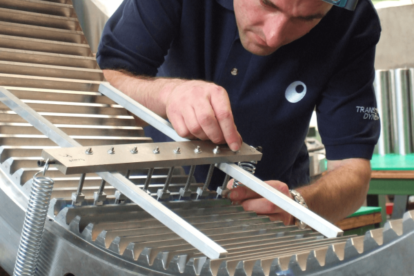Image of technician applying Strain Gauging to a component